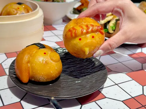 ▲點點心「豬仔流沙包」入侵点爭鮮，換上鮮蝦、玉子燒新造型，變身爆漿銀絲卷。（圖／記者蕭涵云攝）