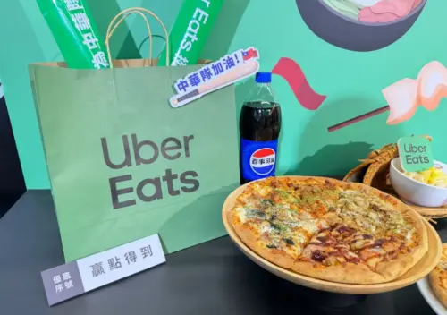 An Uber Eats promotional display features food and beverages at an event in Taiwan. (TCN)