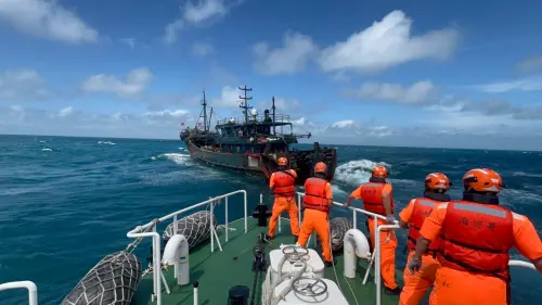 CGA officers attempt to board a mainland Chinese vessel that crossed into restricted waters. (CGA)