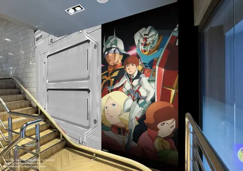 ▲往2樓樓梯間牆面，是聯邦與吉翁公國搏鬥的經典場面，有如深入戰場核心。（圖／麥當勞提供）