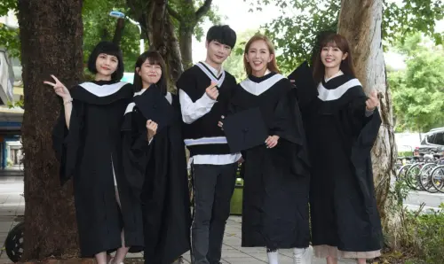 Youths wear gowns during graduation season. (TCN)