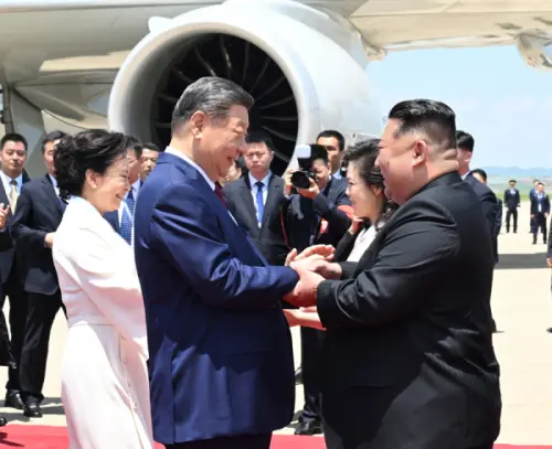 North Korean leader Kim Jong Un greets Chinese President Xi Jinping at Pyongyang airport as he arrives for a state visit on June 8. (Ministry of Foreign Affairs PRC)