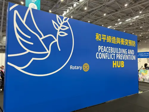 A backdrop with the word "peacebuilding" stands in the Rotary International Convention venue. (TCN)