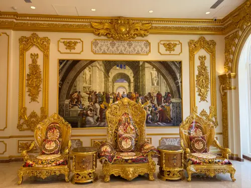 Gold-toned decor, furniture and artwork are displayed inside Chi Deh's headquarters. (TCN)
