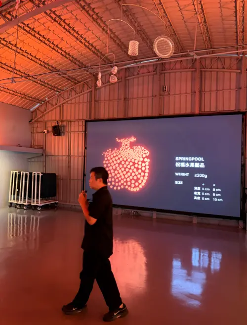 A Spring Pool employee leads a guided tour at its factory in Hsinchu. (TCN)