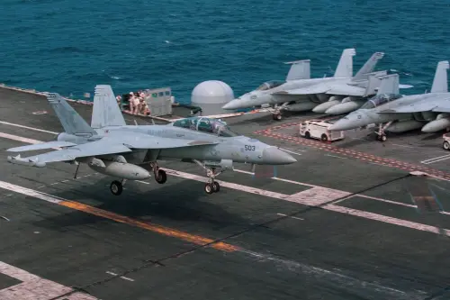 A US Navy F/A-18 lands on the flight deck of the USS George Washington. (Facebook USS George Washington)