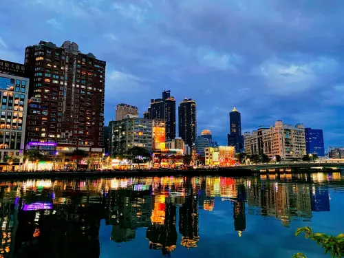 The Love River glows at night, with city lights reflecting across the water. (Kaohsiung Travel Website)