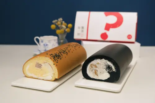 ▲亞尼克生乳捲盲盒新品，左起：「蛋黃酥風味生乳捲」、「黑芝麻脆脆生乳捲」。（圖／亞尼克yannick.com.tw）