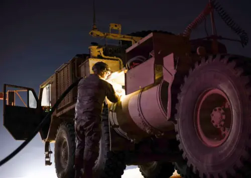 A US soldier fuels a vehicle in the Middle East. (X, US Central Command)